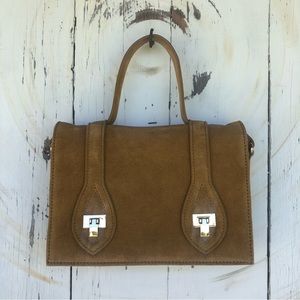 Urban Outfitters tan suede satchel with crossbody strap.